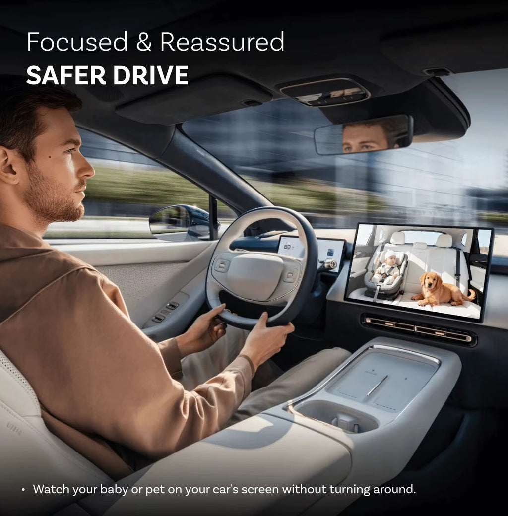 Driver watching baby and dog live on the car screen with BabyDrive Cam baby car camera for CarPlay